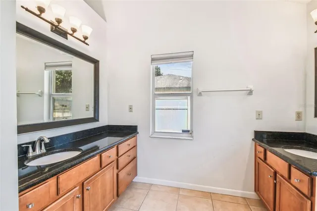 a kitchen with stainless steel appliances granite countertop a stove and a sink