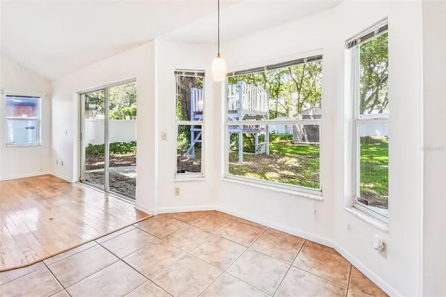 a bathroom with a granite countertop sink a toilet and a bathtub