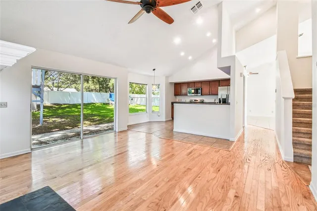 a view of an empty room with a window
