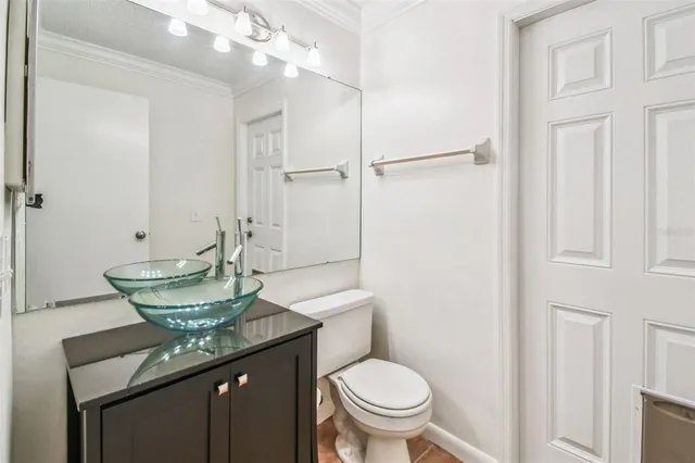 a view of backyard with a barn and a large tree