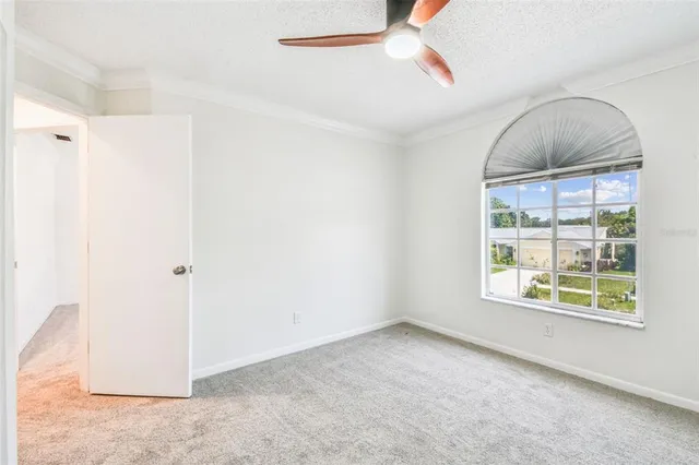 an aerial view of a house with a yard basket ball court and outdoor seating