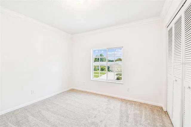 an aerial view of a houses with a yard