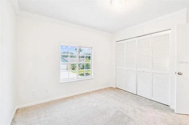 an aerial view of a house with swimming pool garden and tall buildings