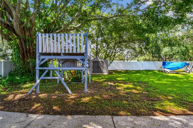 an aerial view of a house having outdoor space patio and swimming pool