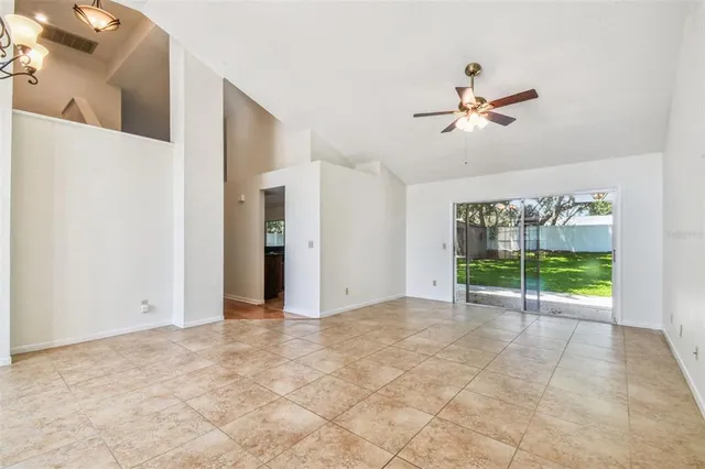 a kitchen with granite countertop white cabinets and a sink
