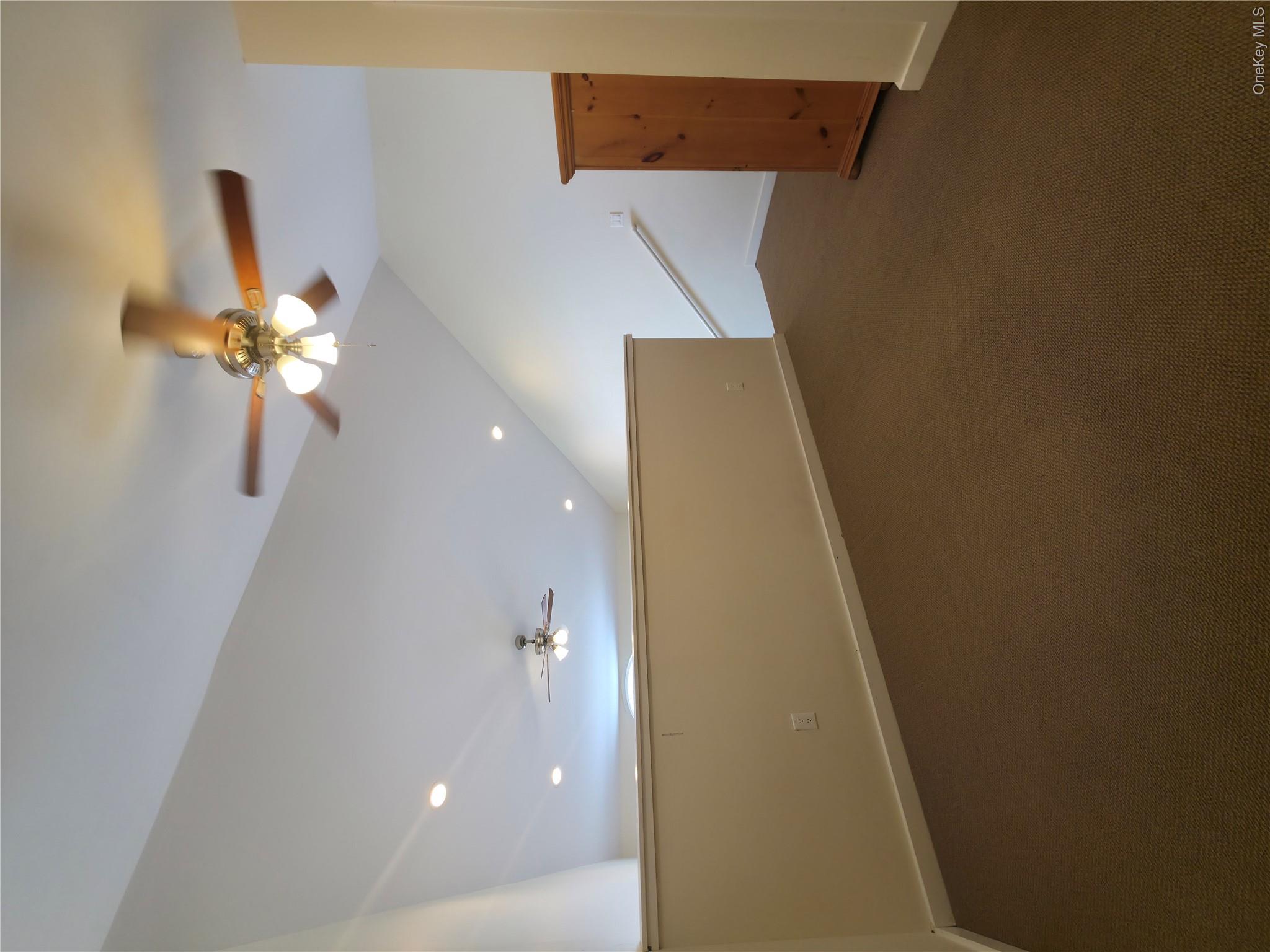 231 Reynolds Road, Unit 11 Loch Sheldrake, NY 12759 - Photo 18 of 20 Bonus room with a ceiling fan, lofted ceiling, baseboards, and dark colored carpet