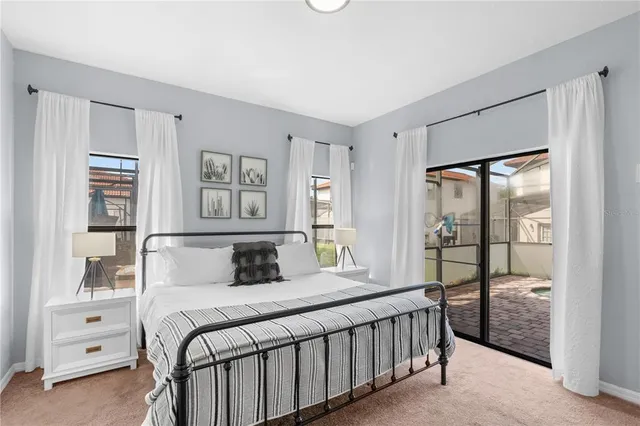 a bedroom with a large bed and a window