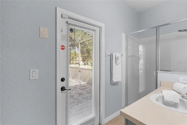 a bathroom with a shower toilet and sink