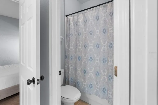 a bathroom with a shower curtain