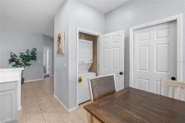 a view of a bedroom with wooden floor and cabinet