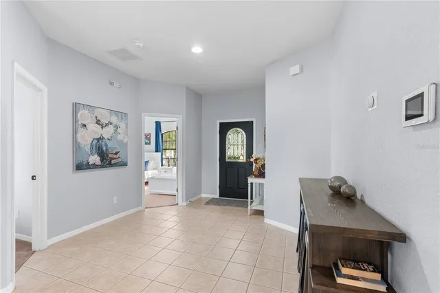 a view of a hallway with closet and cabinet