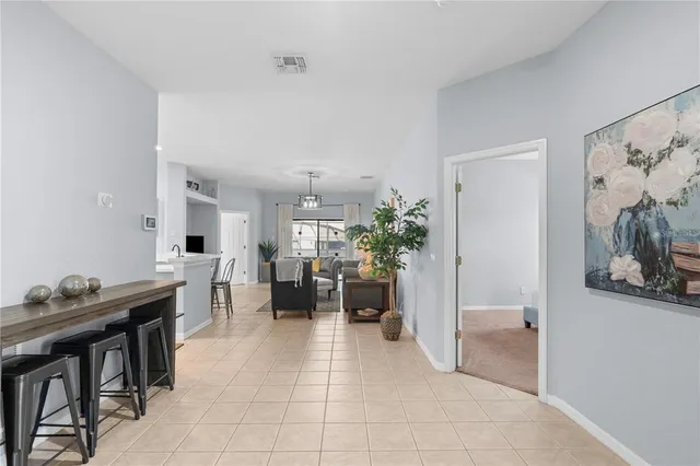 a lobby with furniture and potted plant