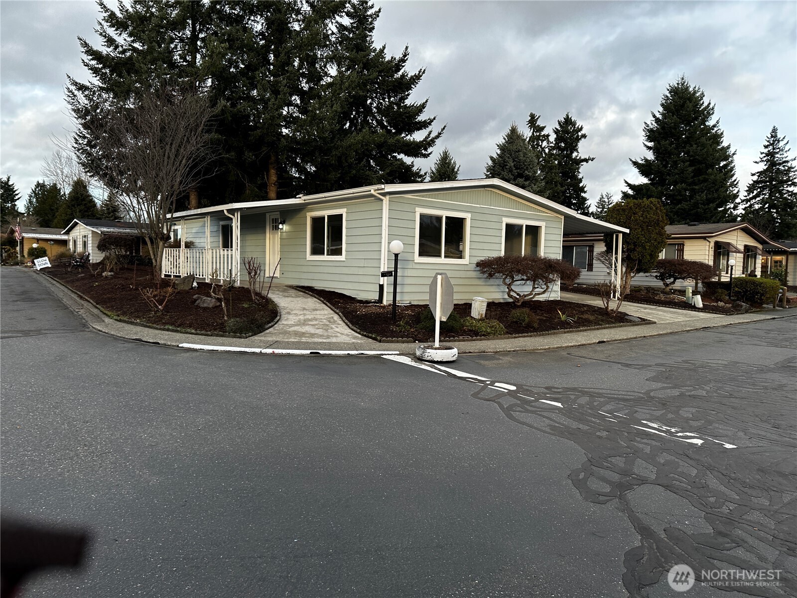 201 Union Avenue Southeast, Unit 249 Renton, WA 98059 - Photo 1 of 15 a front view of a house with a yard and garage