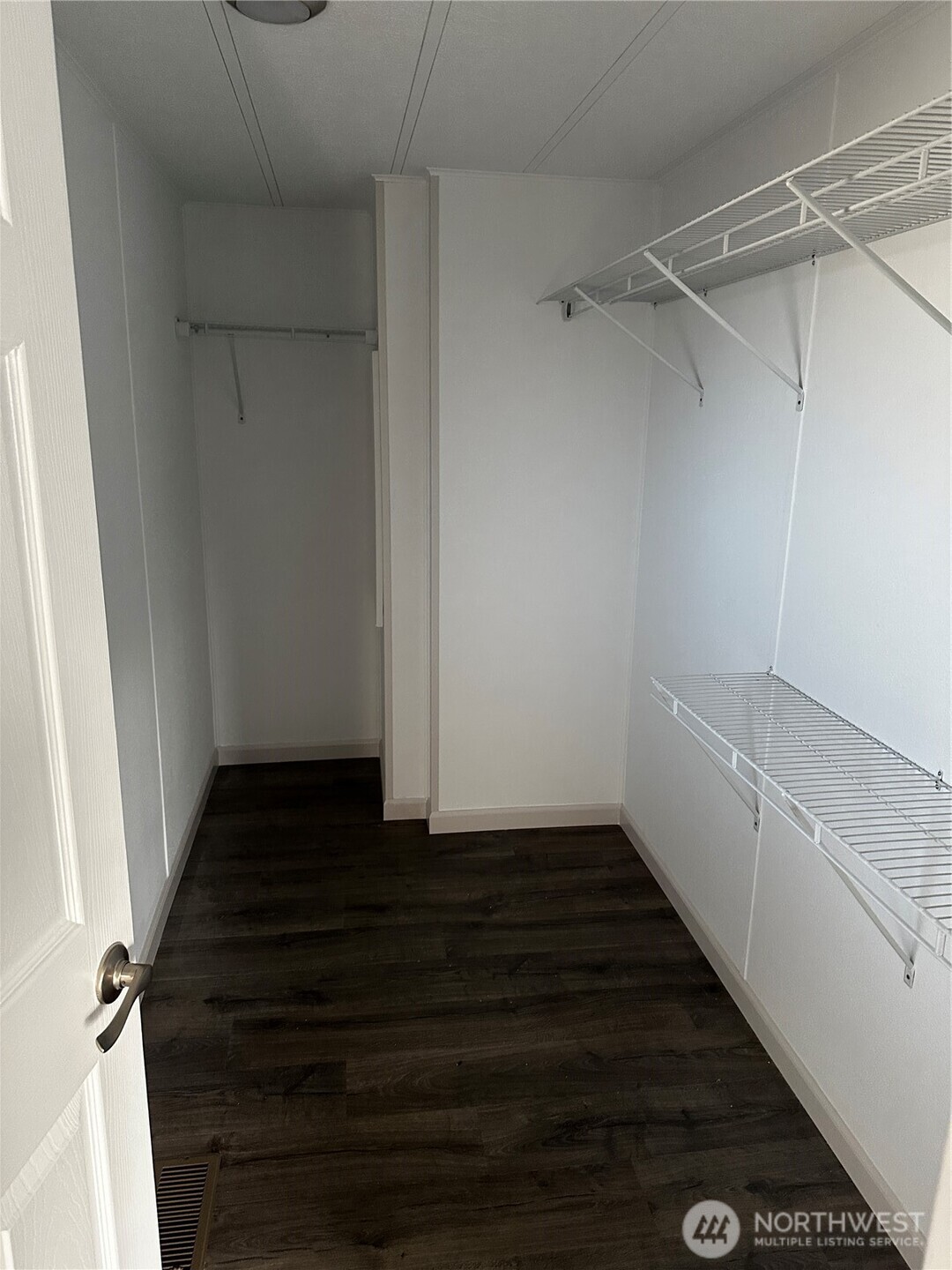 201 Union Avenue Southeast, Unit 249 Renton, WA 98059 - Photo 11 of 15 a view of a room with wooden floor and white walls