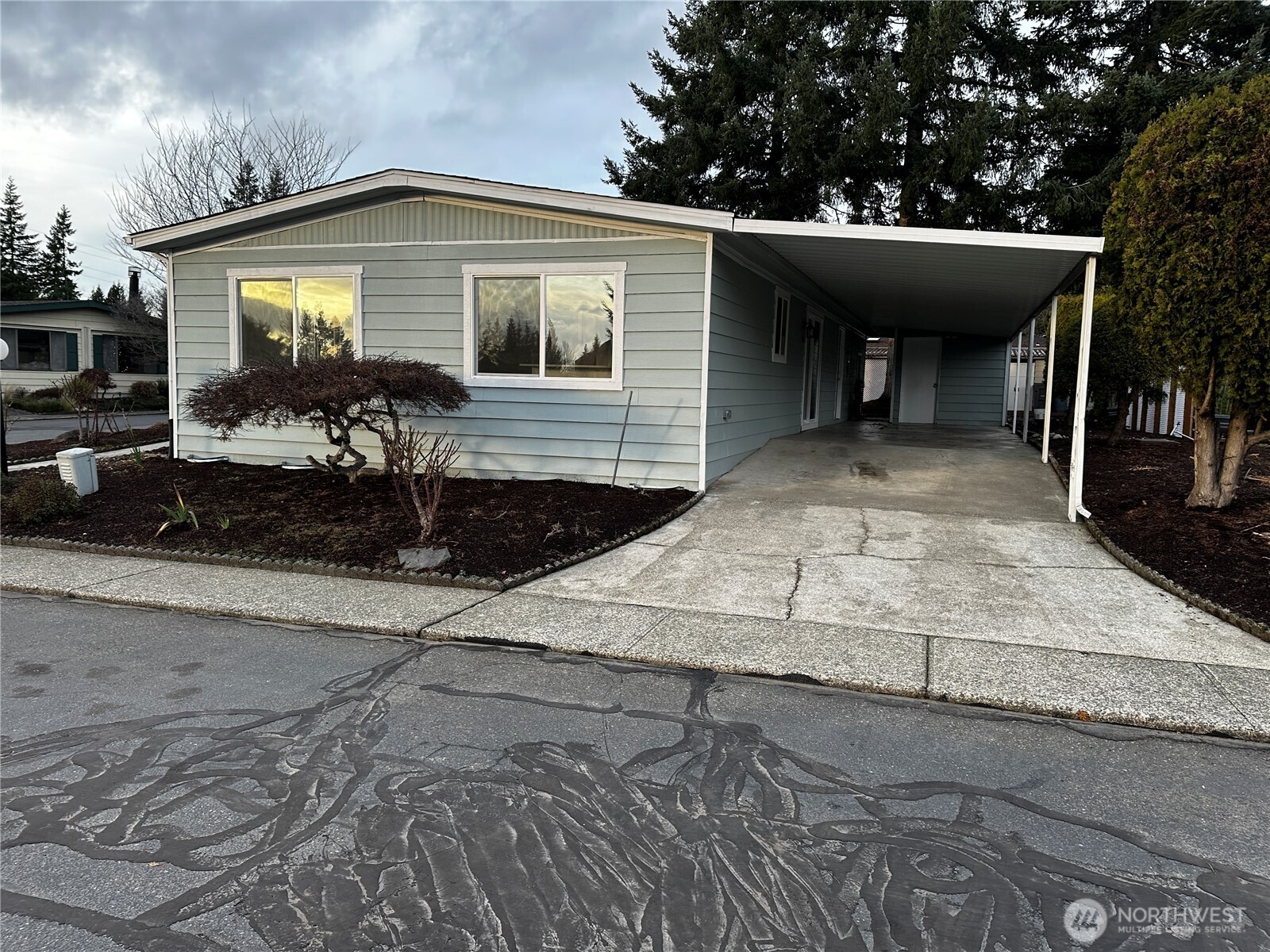 201 Union Avenue Southeast, Unit 249 Renton, WA 98059 - Photo 15 of 15 a front view of a house with garden