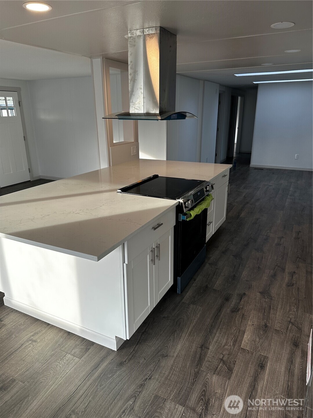 201 Union Avenue Southeast, Unit 249 Renton, WA 98059 - Photo 2 of 15 a kitchen with a stove and a wooden floors