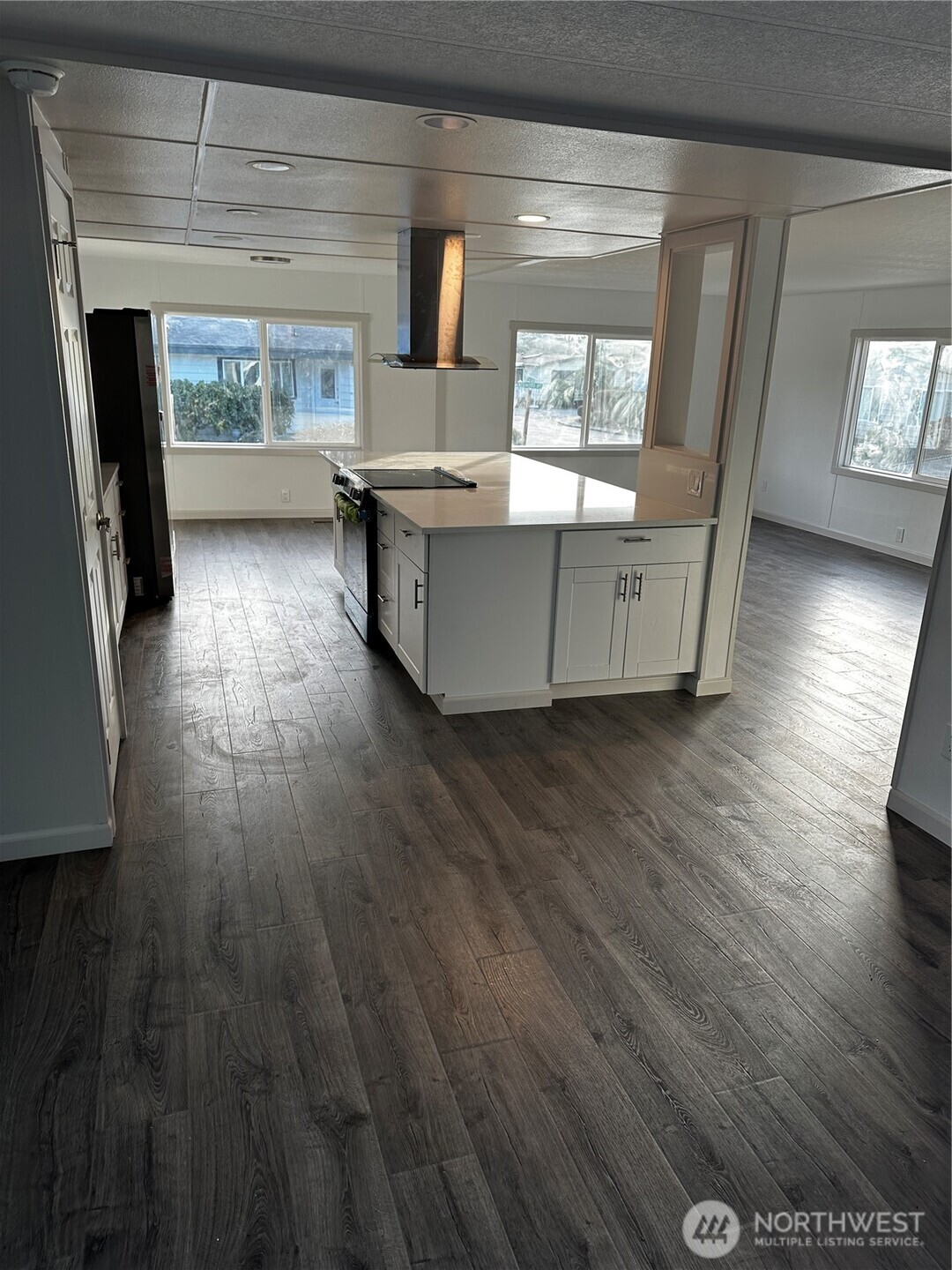 201 Union Avenue Southeast, Unit 249 Renton, WA 98059 - Photo 6 of 15 a view of a kitchen with cabinets and wooden floor