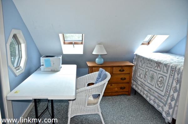 31 Rd To The Plaines Edgartown, MA 02539 - Photo 29 of 36 a bedroom with furniture and a window