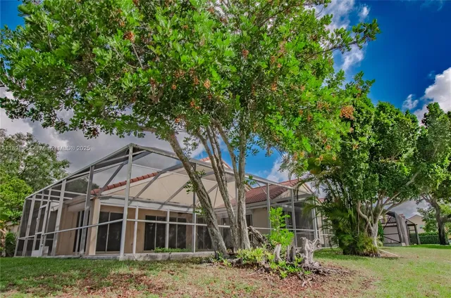 front view of a house with a garden