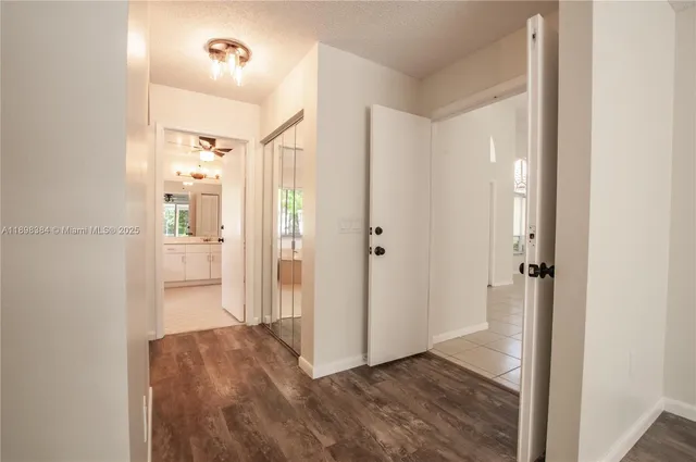 a view of a bathroom with a shower and a sink