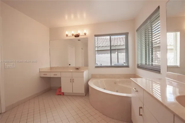 a bathroom with a bathtub and a sink