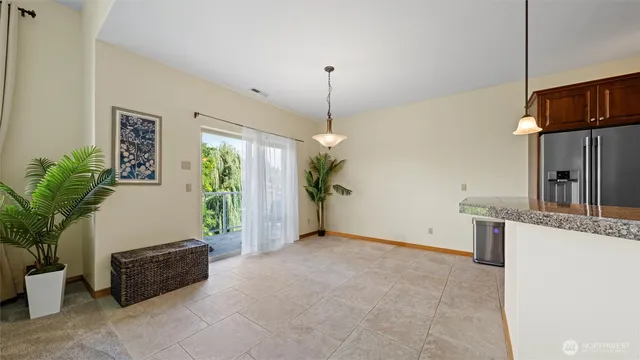 a view of a livingroom with furniture and a window