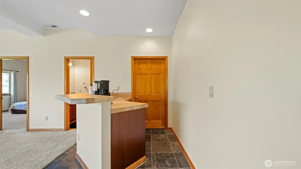 an empty room with furniture and a fireplace