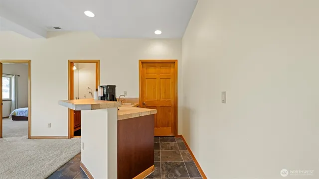 an empty room with furniture and a fireplace
