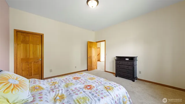 a spacious bathroom with a double vanity sink and a mirror