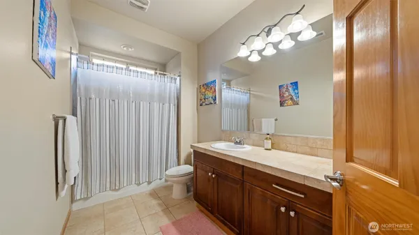 a bathroom with a double vanity sink mirror and double