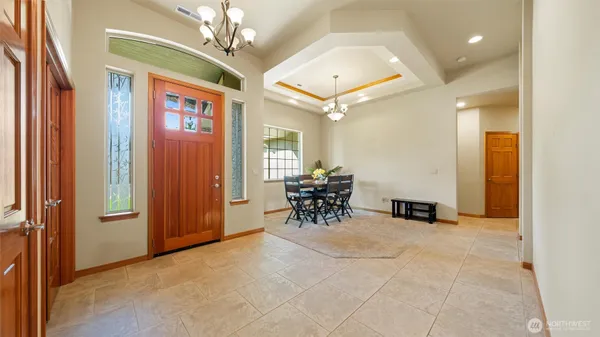 en view of a livingroom with furniture and a ceiling fan