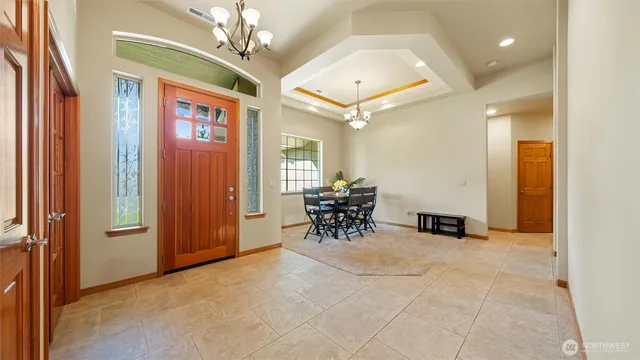en view of a livingroom with furniture and a ceiling fan