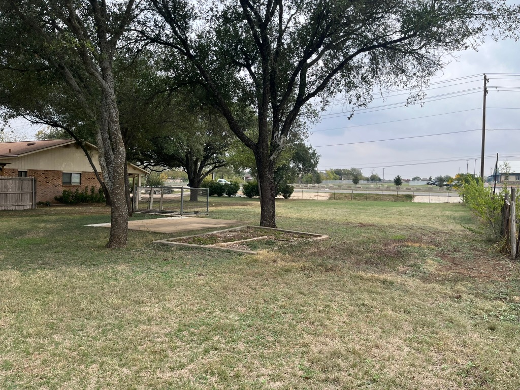 670 Farm To Market 1626 Buda, TX 78610 - Photo 11 of 15 a view of a yard with a tree