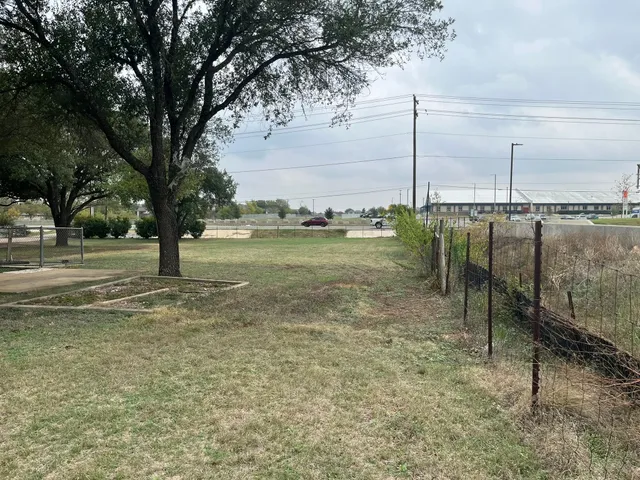 a view of an empty room with a fireplace
