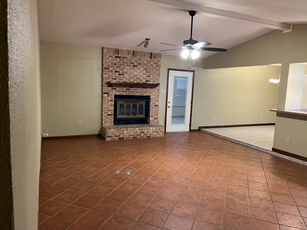 670 Farm To Market 1626 Buda, TX 78610 - Photo 13 of 15 a view of an empty room with a fireplace