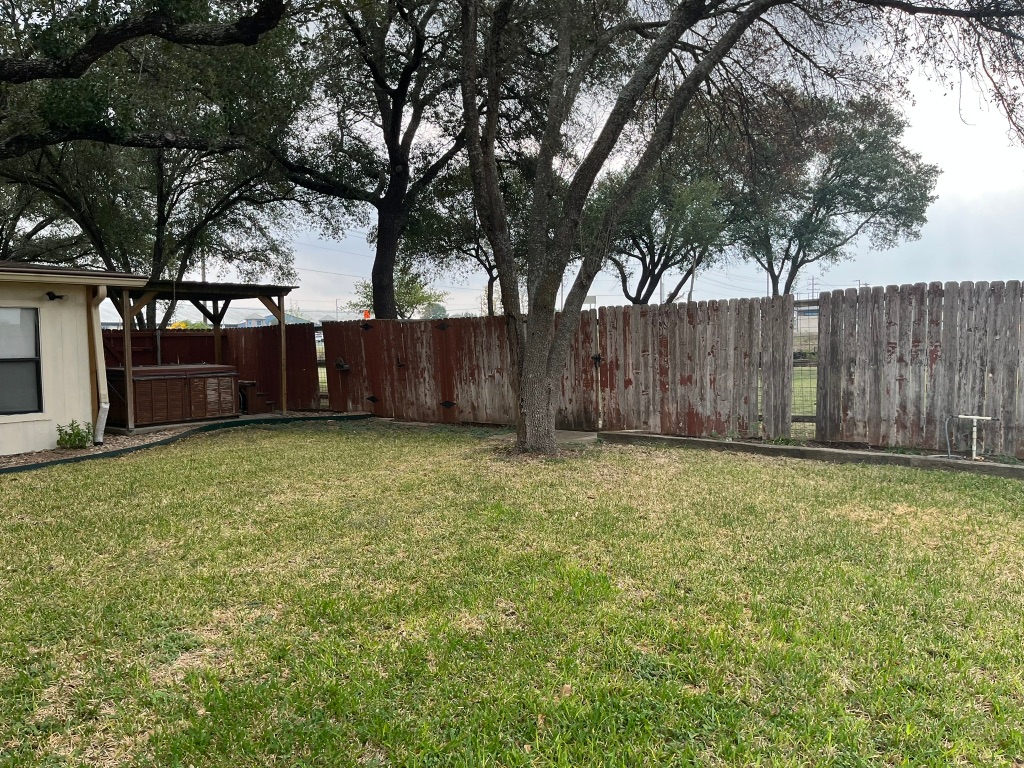 670 Farm To Market 1626 Buda, TX 78610 - Photo 2 of 15 a view of a backyard