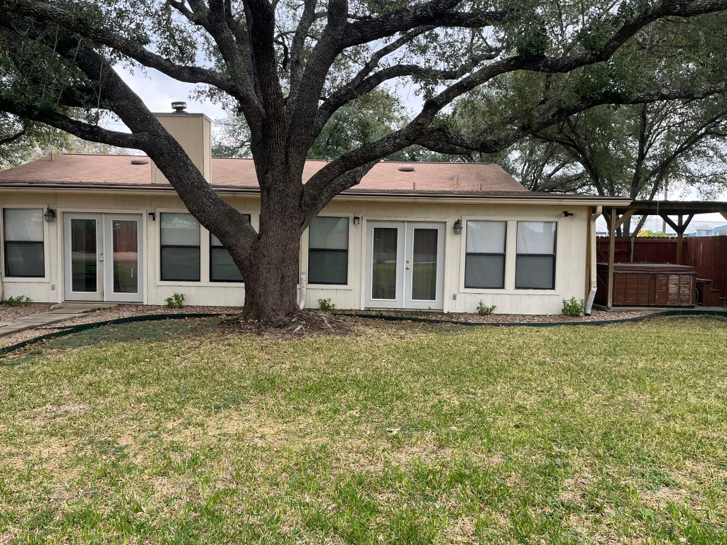 670 Farm To Market 1626 Buda, TX 78610 - Photo 6 of 15 front view of a house with a yard