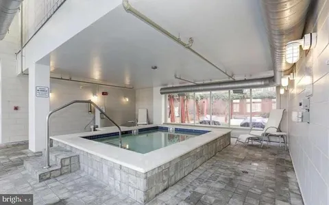 a view of a living room and chandelier
