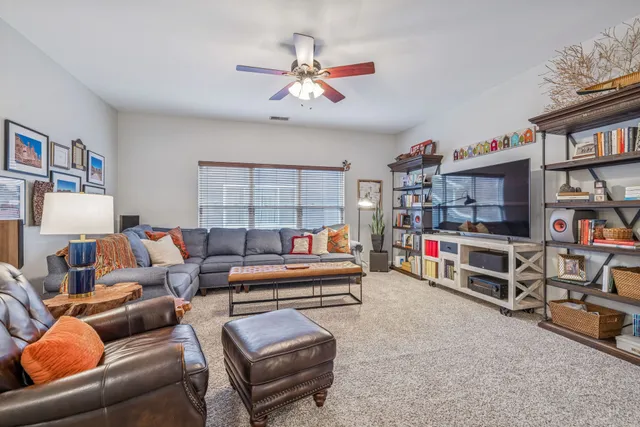 a bathroom with a granite countertop sink mirror and vanity