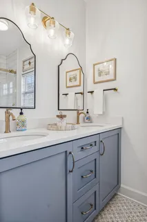 a living room with furniture and a bookshelf