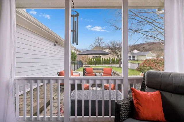 a view of a house with a yard and deck