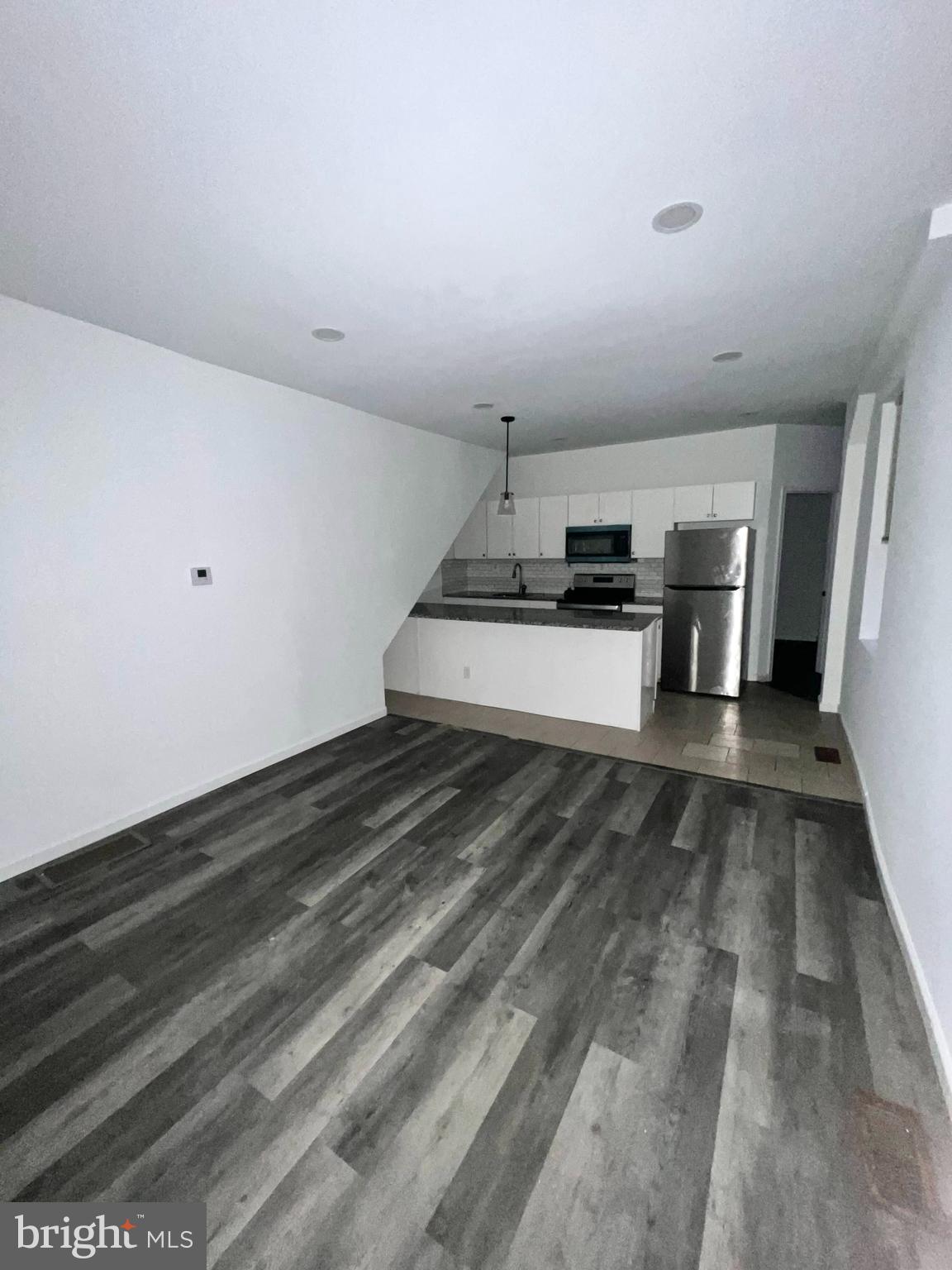7034 North Broad Street Philadelphia, PA 19126 - Photo 3 of 13 a kitchen with stove and cabinets