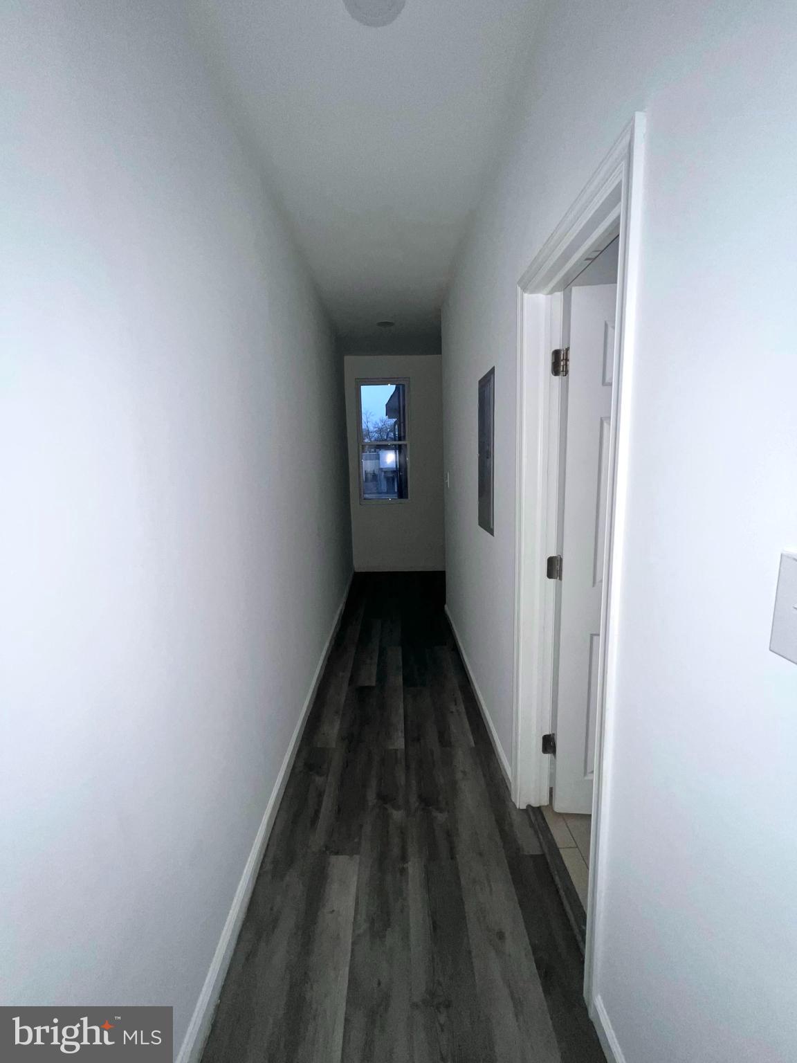 7034 North Broad Street Philadelphia, PA 19126 - Photo 6 of 13 a view of a hallway with wooden floor and a bathroom