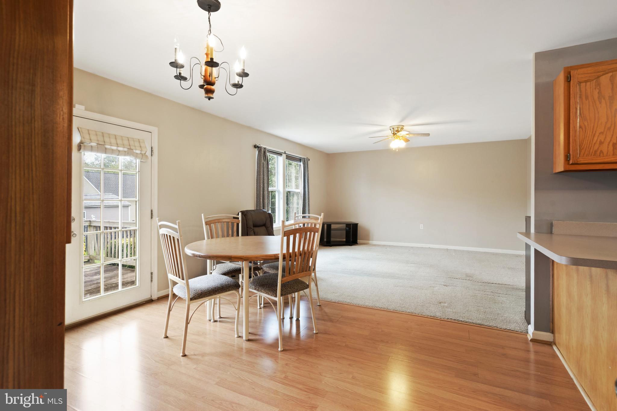112 Brin Drive Ranson, WV 25438 - Photo 11 of 26 a view of a dining room with furniture window and wooden floor