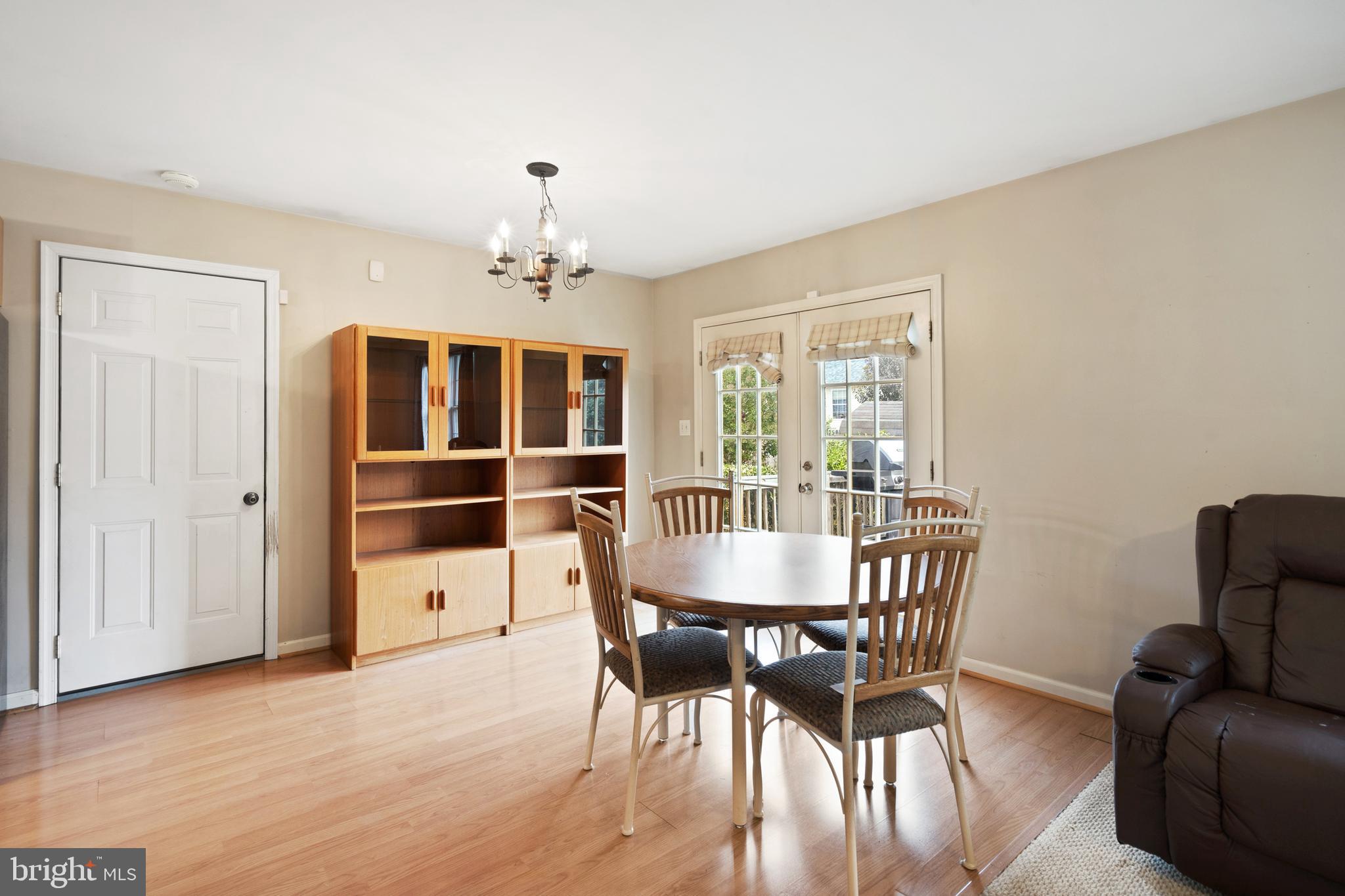 112 Brin Drive Ranson, WV 25438 - Photo 12 of 26 a dining room with furniture a chandelier and wooden floor