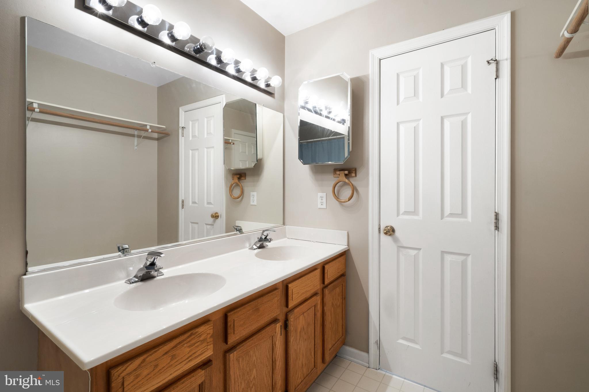 112 Brin Drive Ranson, WV 25438 - Photo 22 of 26 a bathroom with a sink and a mirror