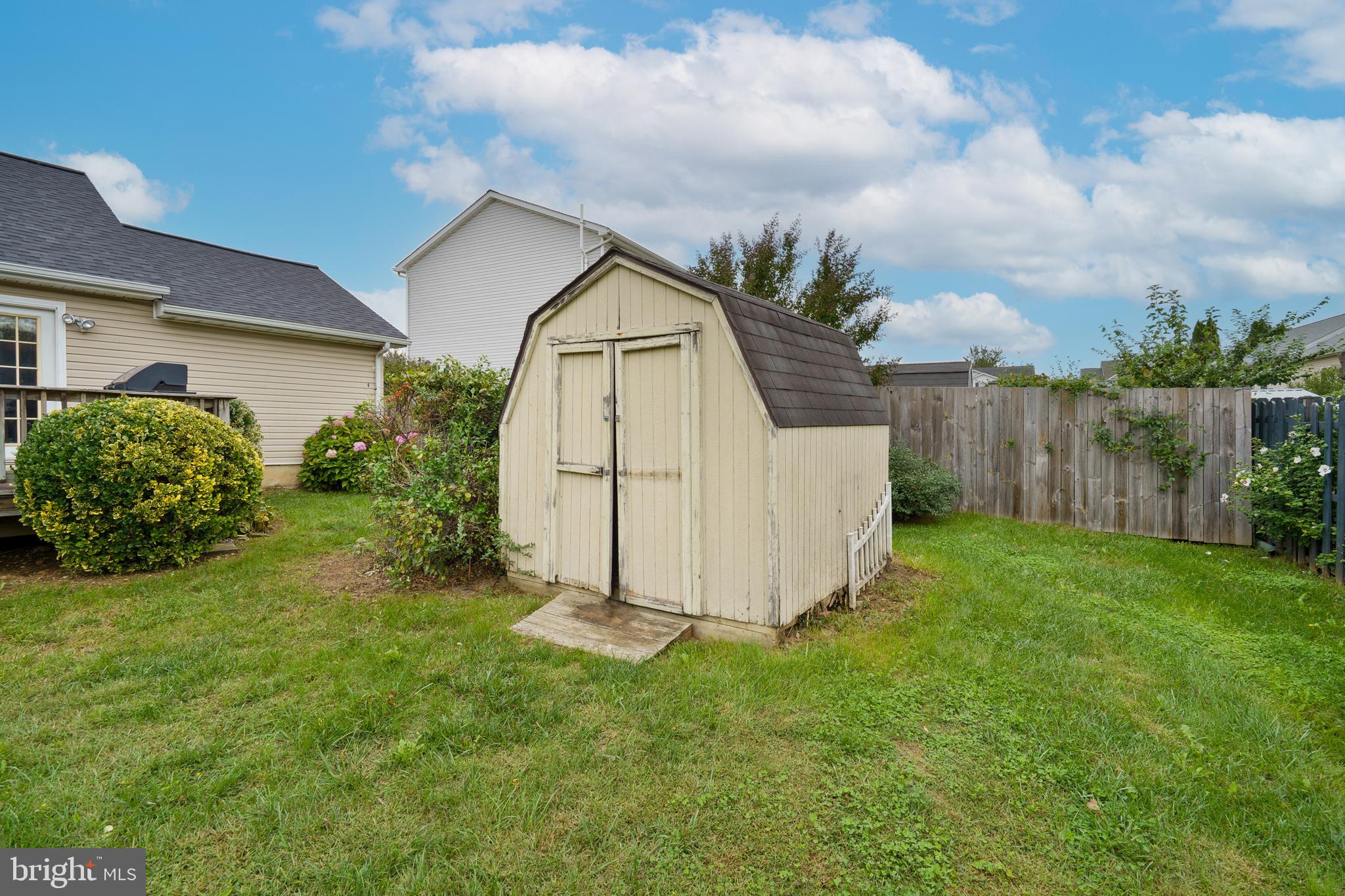 112 Brin Drive Ranson, WV 25438 - Photo 24 of 26 a front view of a house with garden