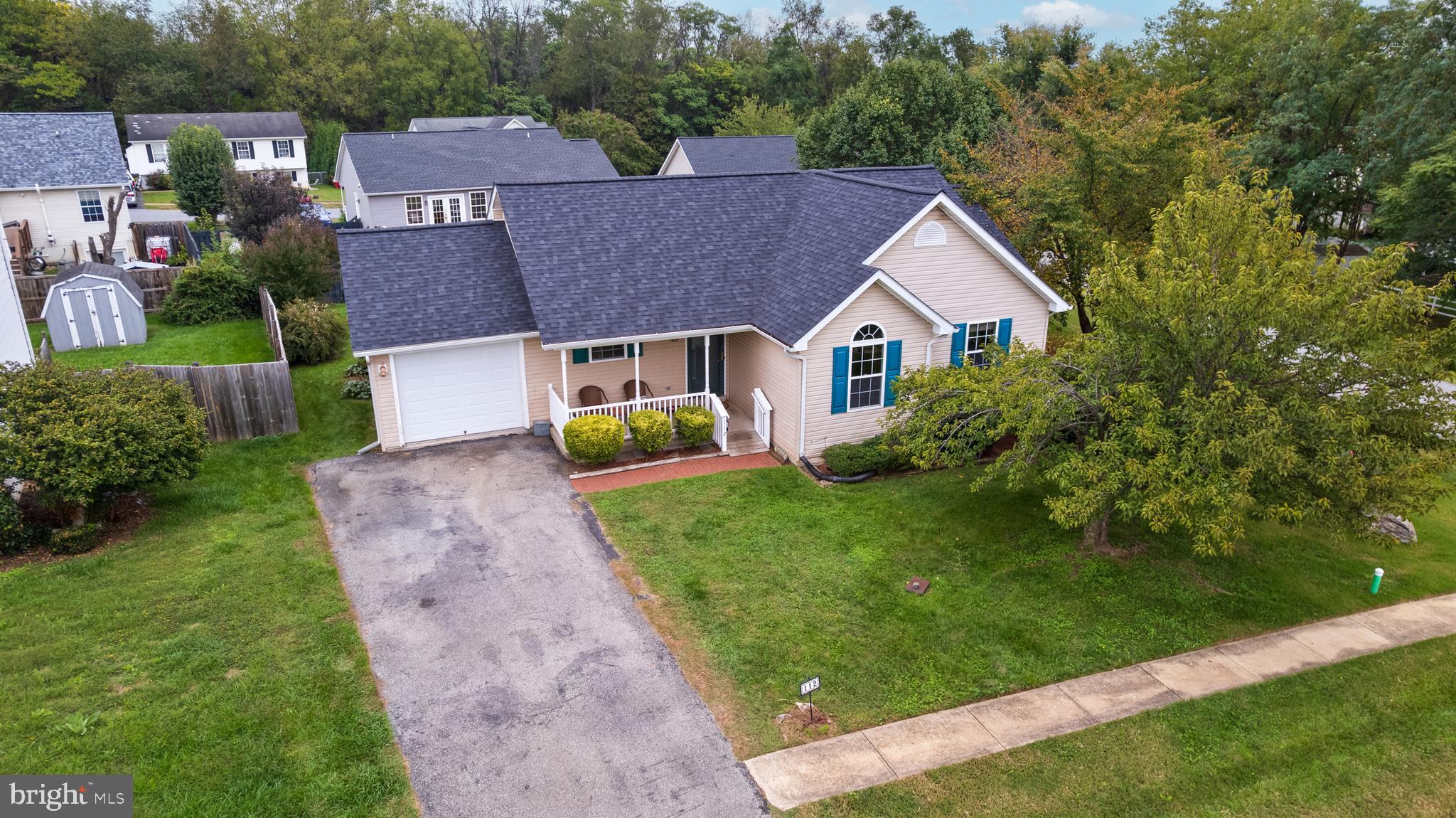 112 Brin Drive Ranson, WV 25438 - Photo 4 of 26 a aerial view of a house with a big yard plants and large trees