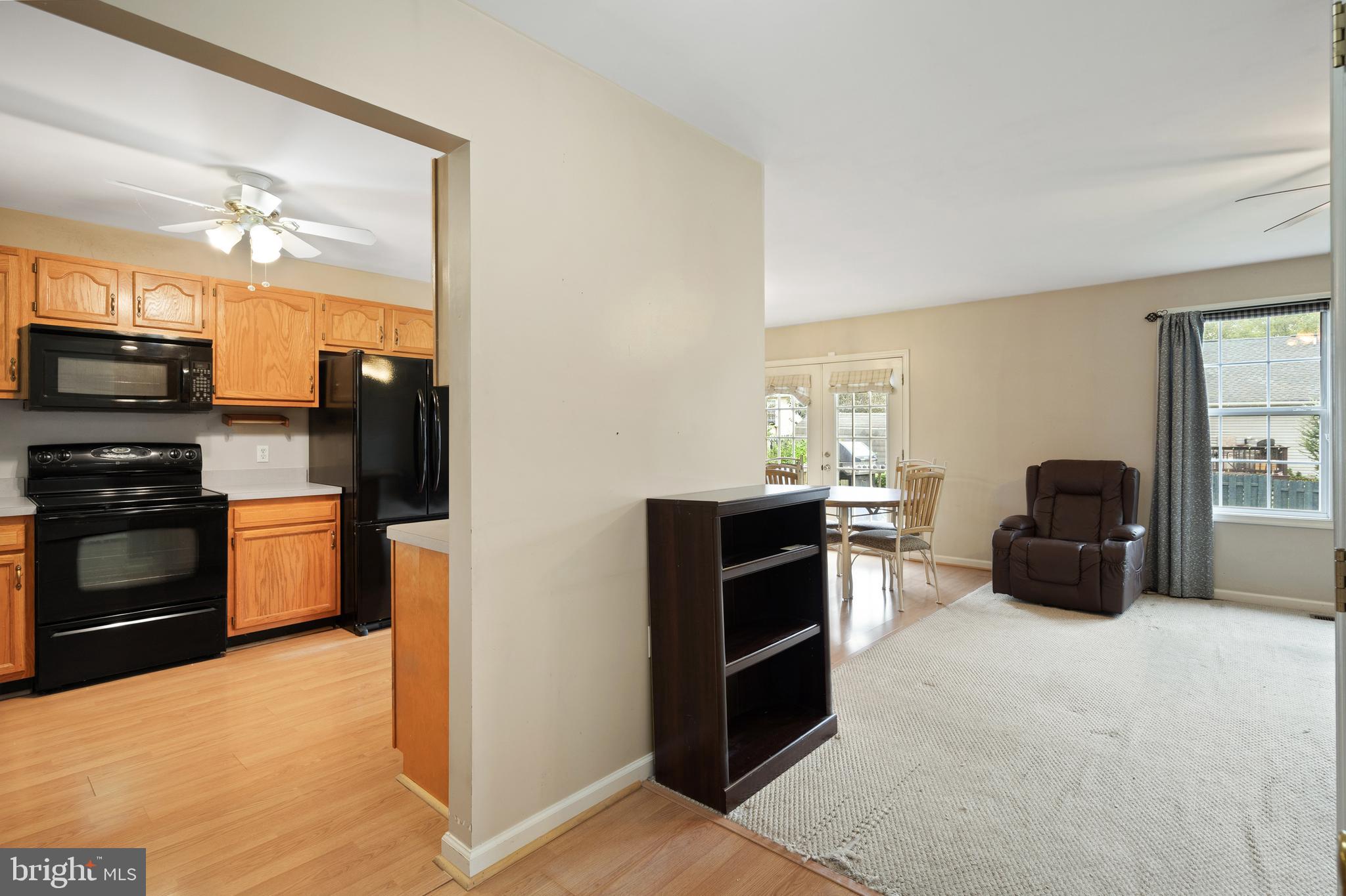 112 Brin Drive Ranson, WV 25438 - Photo 8 of 26 a kitchen with stainless steel appliances a stove refrigerator and microwave