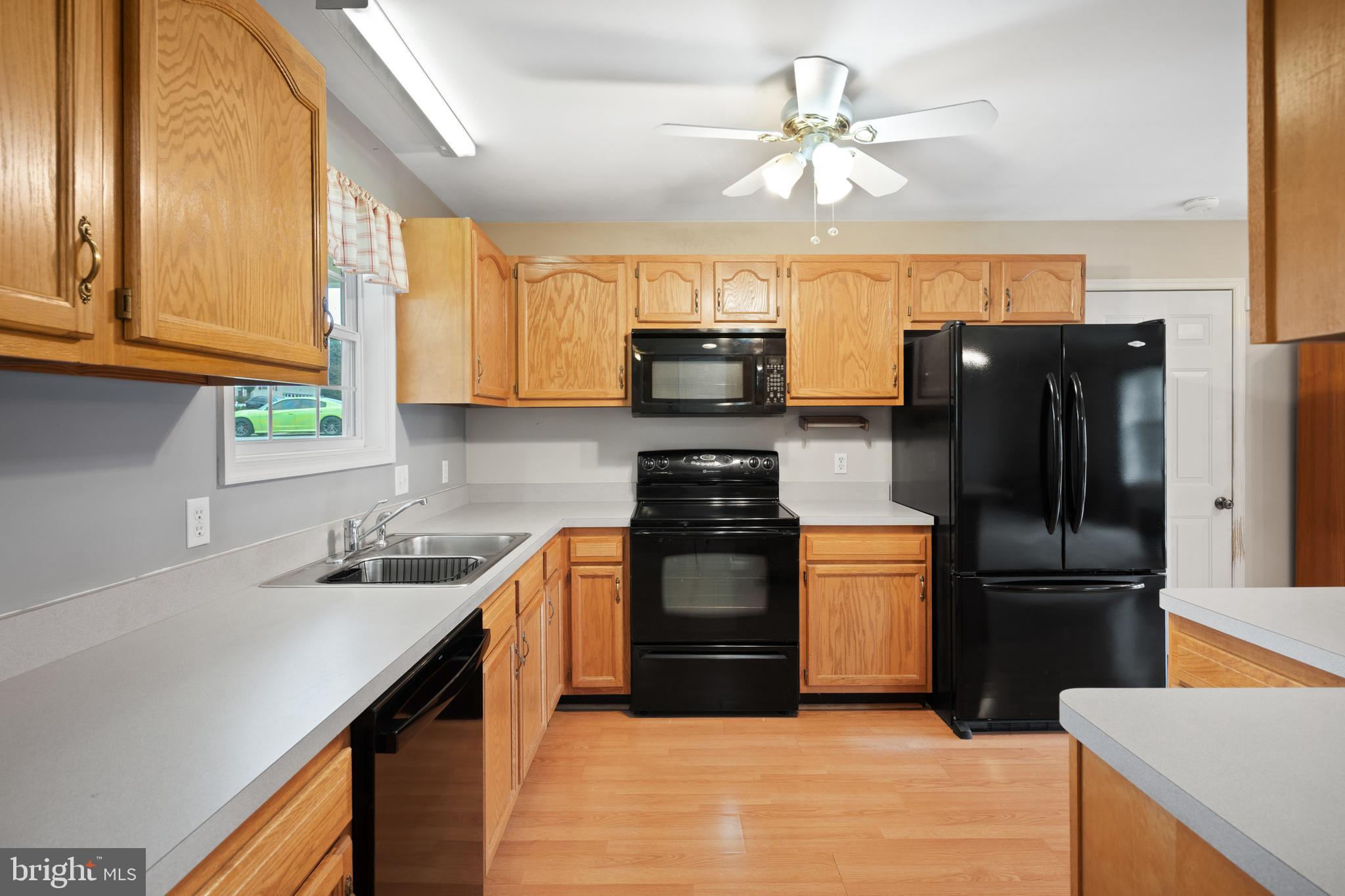 112 Brin Drive Ranson, WV 25438 - Photo 9 of 26 a kitchen with a refrigerator sink and stove